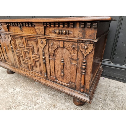 1036 - An old oak coffer, 114.5cm wide.