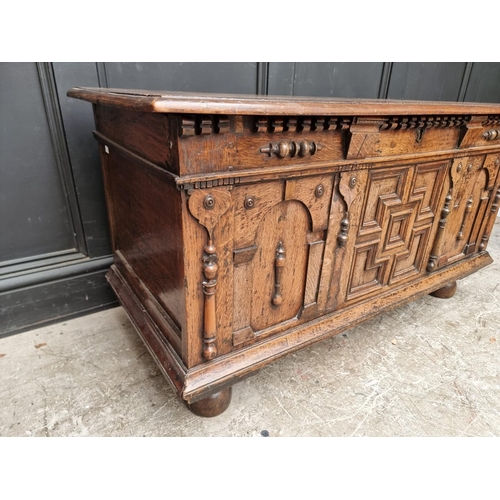 1036 - An old oak coffer, 114.5cm wide.