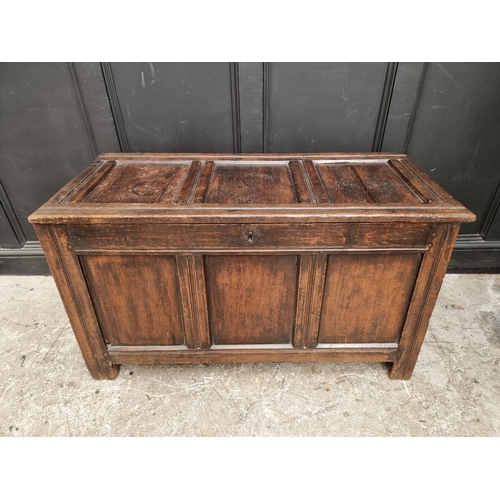 1037 - A late 17th century oak panelled coffer, 122.5cm wide.