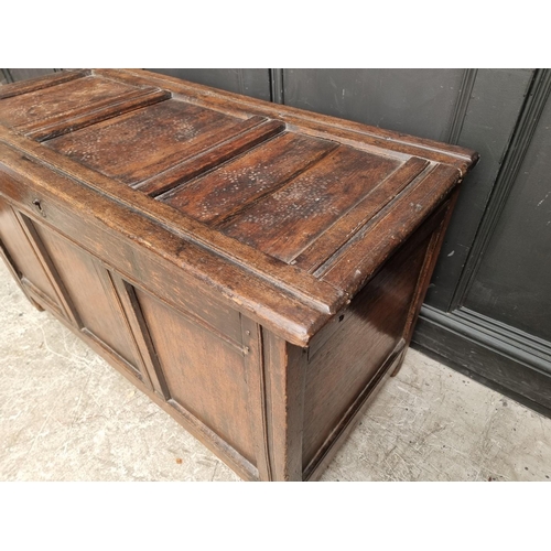 1037 - A late 17th century oak panelled coffer, 122.5cm wide.