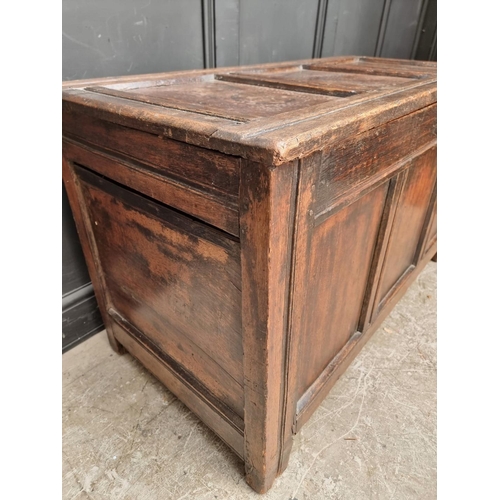 1037 - A late 17th century oak panelled coffer, 122.5cm wide.