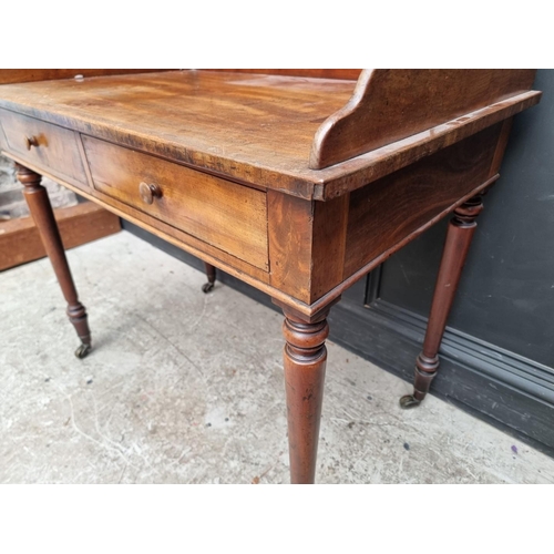 1039 - A 19th century mahogany washstand, 96cm wide.