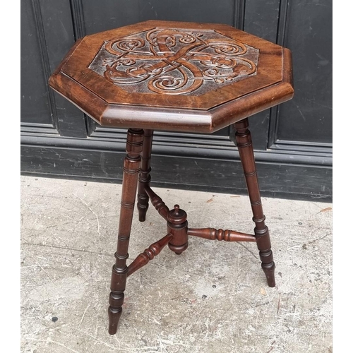 1041 - A carved mahogany octagonal three legged occasional table, 49.5cm wide.