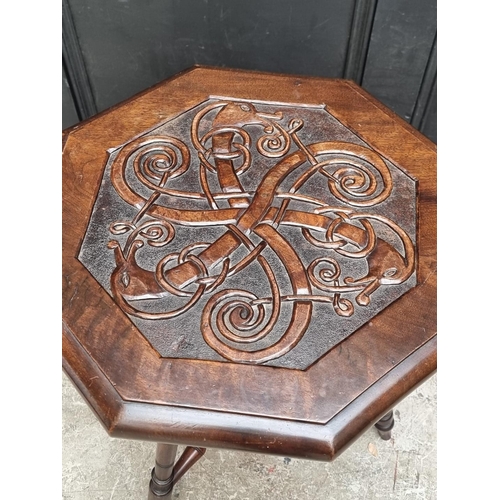 1041 - A carved mahogany octagonal three legged occasional table, 49.5cm wide.