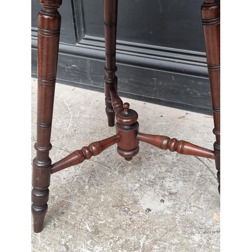 1041 - A carved mahogany octagonal three legged occasional table, 49.5cm wide.