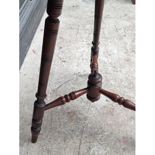 1041 - A carved mahogany octagonal three legged occasional table, 49.5cm wide.