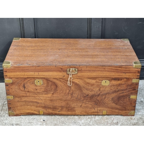 1044 - An antique camphor wood and brass bound chest, 101.5cm wide.