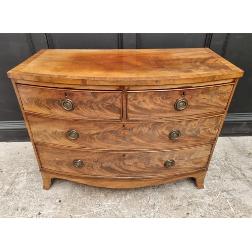 1045 - A Regency figured mahogany and crossbanded  bowfront chest of drawers, 104.5cm wide.... 