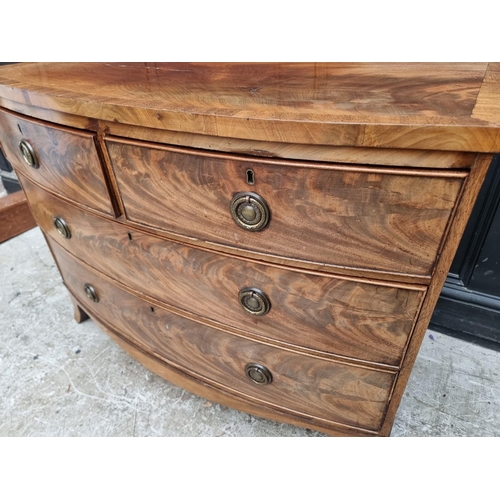 1045 - A Regency figured mahogany and crossbanded  bowfront chest of drawers, 104.5cm wide.... 