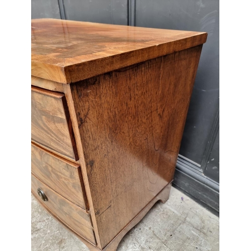 1045 - A Regency figured mahogany and crossbanded  bowfront chest of drawers, 104.5cm wide.... 