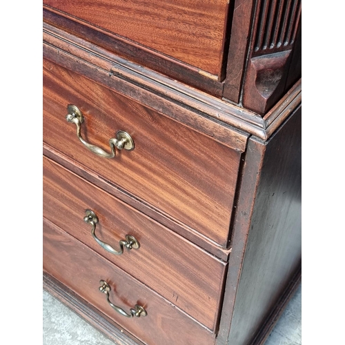 1052 - A George III mahogany chest on chest, 111cm wide, (feet replaced).