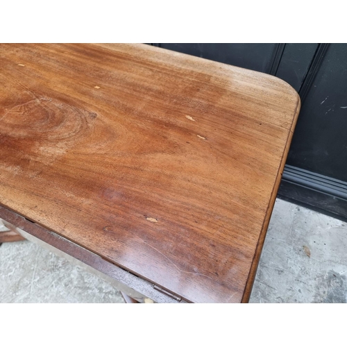 1057 - A 19th century mahogany tilt-top breakfast table, with drop leaf to one side, 122.5cm wide.... 