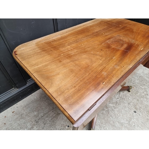 1057 - A 19th century mahogany tilt-top breakfast table, with drop leaf to one side, 122.5cm wide.... 