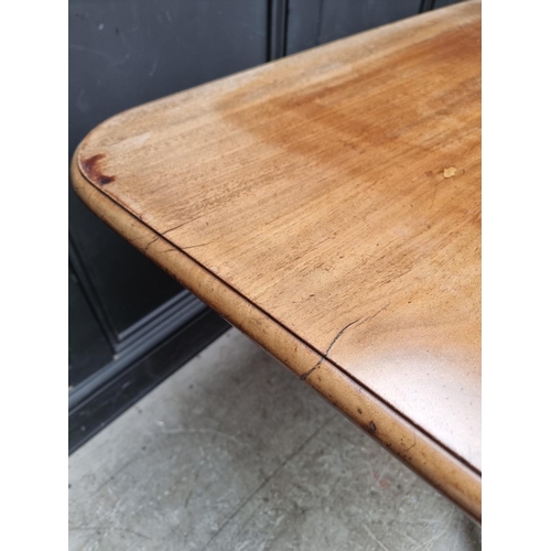 1057 - A 19th century mahogany tilt-top breakfast table, with drop leaf to one side, 122.5cm wide.... 