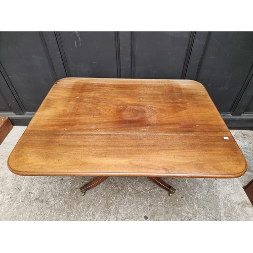 1057 - A 19th century mahogany tilt-top breakfast table, with drop leaf to one side, 122.5cm wide.... 