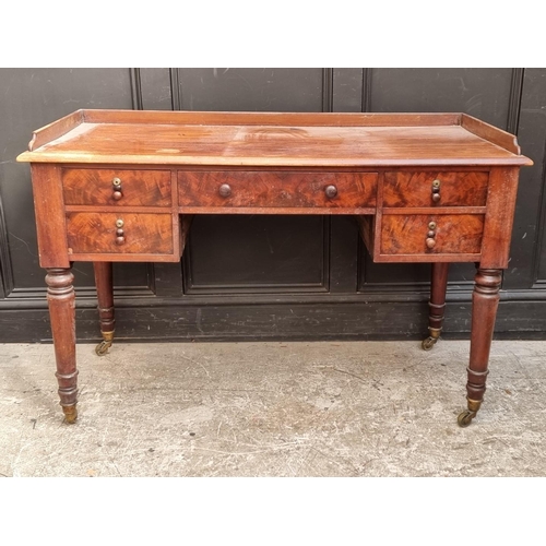 1059 - A Victorian mahogany washstand, 122cm wide.