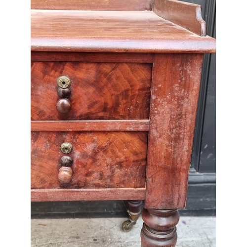 1059 - A Victorian mahogany washstand, 122cm wide.