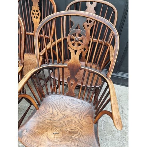 1062 - Four similar 19th century ash, elm and beech wheelback Windsor armchairs.