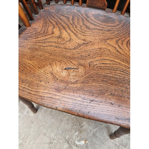 1062 - Four similar 19th century ash, elm and beech wheelback Windsor armchairs.