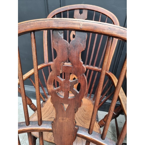 1062 - Four similar 19th century ash, elm and beech wheelback Windsor armchairs.