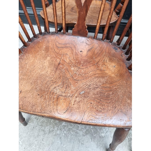 1062 - Four similar 19th century ash, elm and beech wheelback Windsor armchairs.