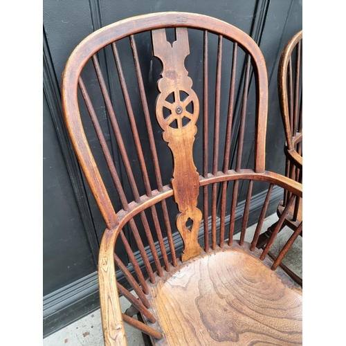 1062 - Four similar 19th century ash, elm and beech wheelback Windsor armchairs.