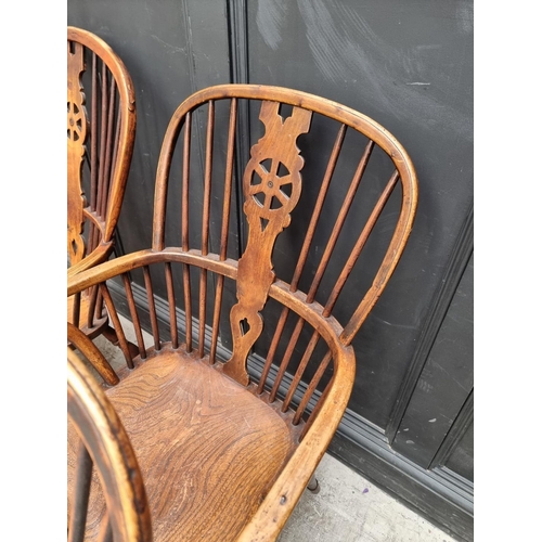 1062 - Four similar 19th century ash, elm and beech wheelback Windsor armchairs.