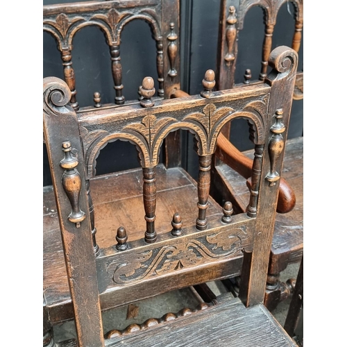 1063 - A set of six antique carved oak dining chairs, to include an elbow chair.