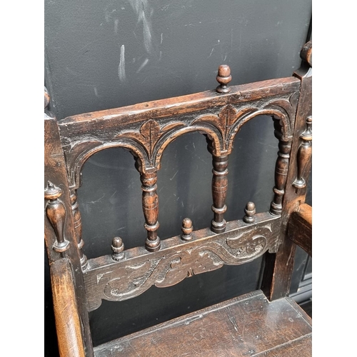 1063 - A set of six antique carved oak dining chairs, to include an elbow chair.