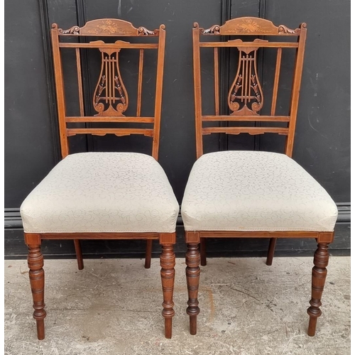 1068 - A pair of late 19th century rosewood and inlaid lyre back salon chairs.