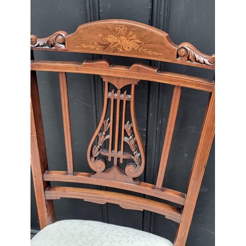 1068 - A pair of late 19th century rosewood and inlaid lyre back salon chairs.