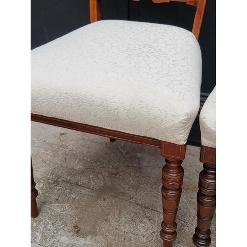 1068 - A pair of late 19th century rosewood and inlaid lyre back salon chairs.