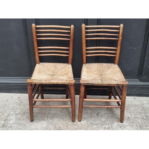 1072 - A pair of Victorian ash, beech and rush seated side chairs.