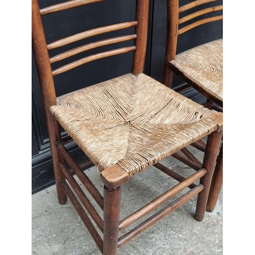 1072 - A pair of Victorian ash, beech and rush seated side chairs.