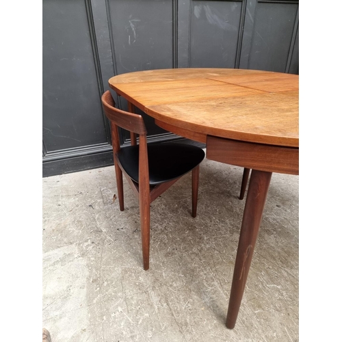 1079 - A mid-century Danish teak 'Roundette' dining table and six chairs, by Hans Olsen for Frem Rojle... 