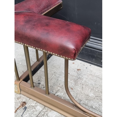 1081 - An old brass and studded leatherette adjustable club fender, 143.5-163.5cm wide.