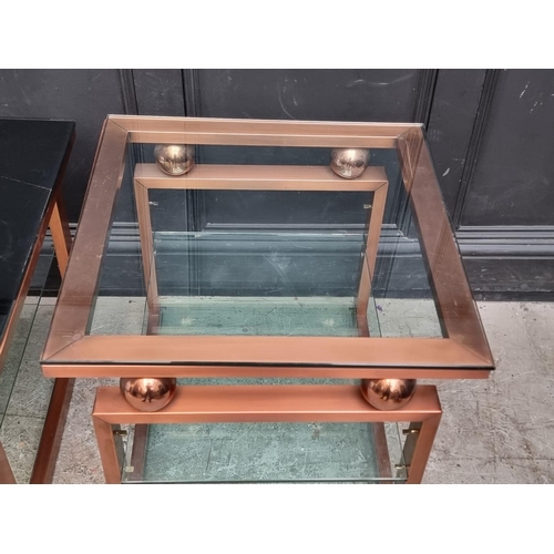 1082 - A pair of lacquered brass and glass square low tables, 60cm wide.