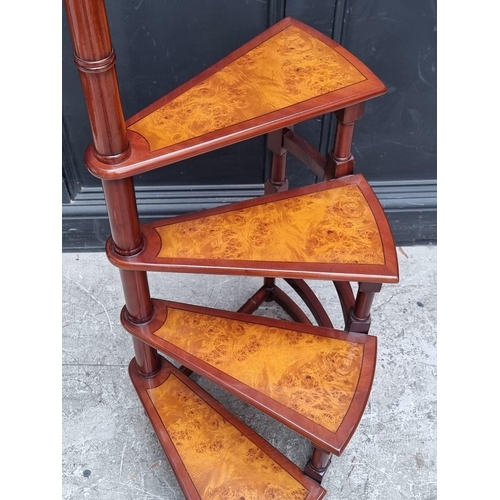 1084 - A set of mahogany and burr walnut spiral four tread library steps, 159cm high.