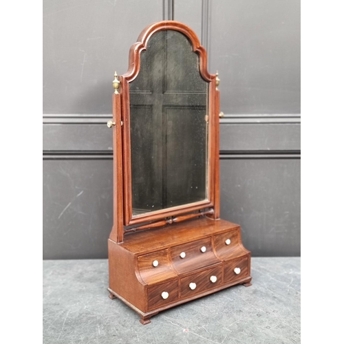 1093 - A Queen Anne style mahogany toilet mirror, with bone knobs, 80.5cm high.