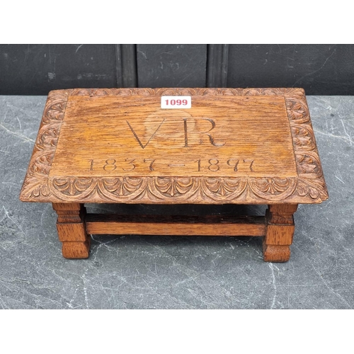 1099 - A Victorian carved oak 1897 Jubilee commemorative footstool, 28cm wide.