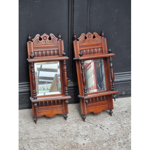 1103 - A pair of Edwardian mahogany mirror back wall shelves, 61 x 24.5cm.