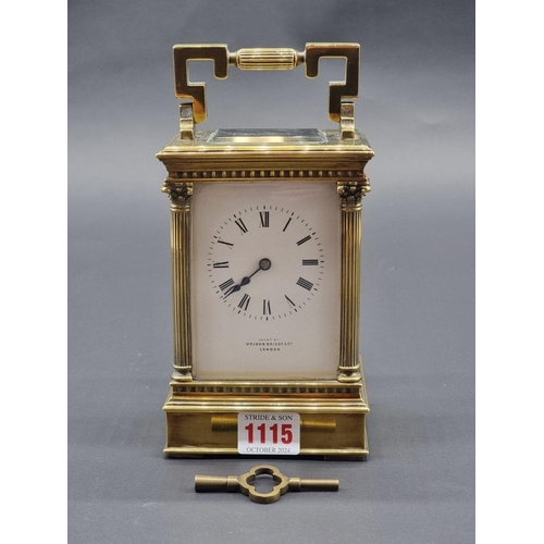 1115 - A large brass carriage clock, striking on a gong, the enamel dial inscribed 'Upjohn, Bright &am... 