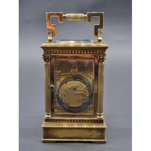 1115 - A large brass carriage clock, striking on a gong, the enamel dial inscribed 'Upjohn, Bright &am... 