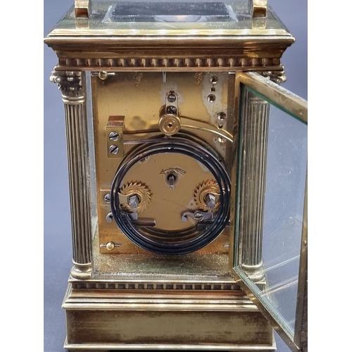 1115 - A large brass carriage clock, striking on a gong, the enamel dial inscribed 'Upjohn, Bright &am... 