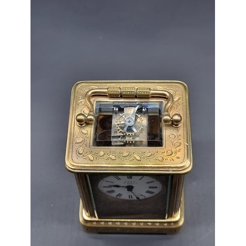 1117 - A small antique engraved brass carriage timepiece, the enamel dial inscribed 'Dent, 61 Strand, Londo... 