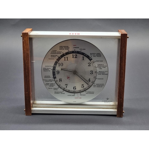 1119 - A vintage Lord King world time clock, 23cm wide.