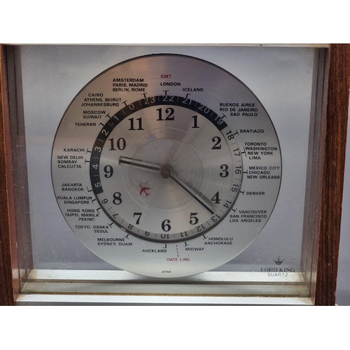 1119 - A vintage Lord King world time clock, 23cm wide.