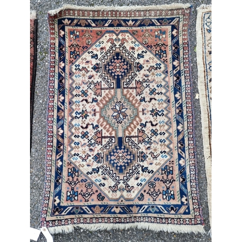 1128 - Three Persian prayer rugs, largest 92 x 61cm.