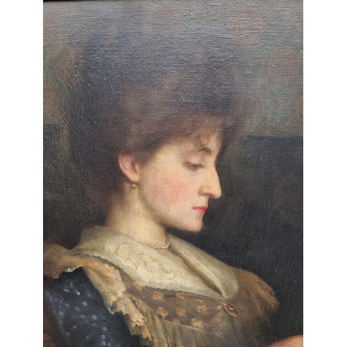 1175 - English School, early 20th century, bust length portrait of a lady reading, oil on canvas, 62.5 x 74... 