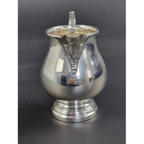 11 - A silver milk jug, by Elkington & Co, Birmingham 1968, 10.5cm high, 169g.